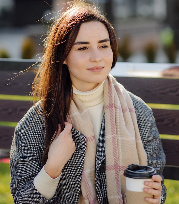 Alt Text: Smiling female client featured in testimonial section