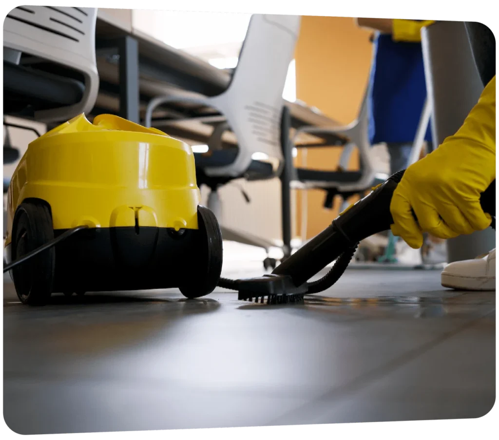 Commercial floor cleaning using scrubbing machine in office space