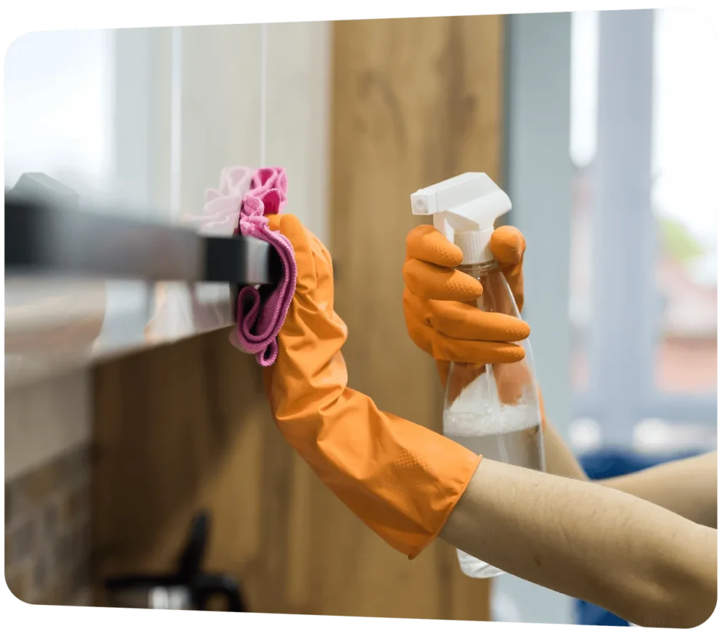 Commercial window cleaning with spray bottle and microfiber cloth